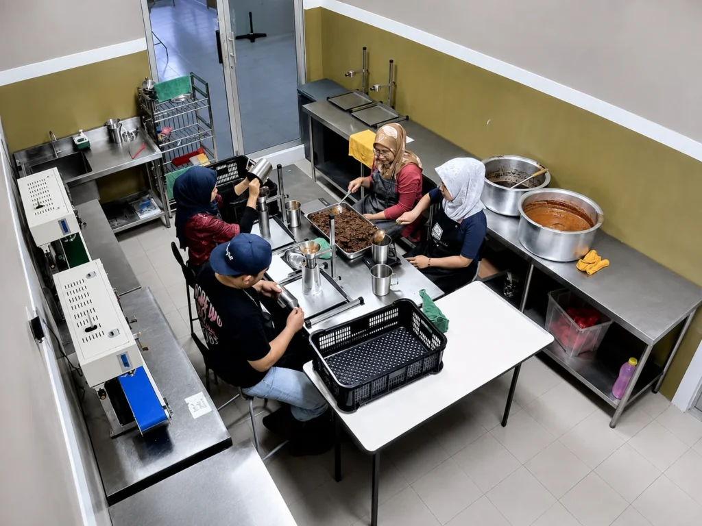 Food preparation in the DapoGo factory kitchen.